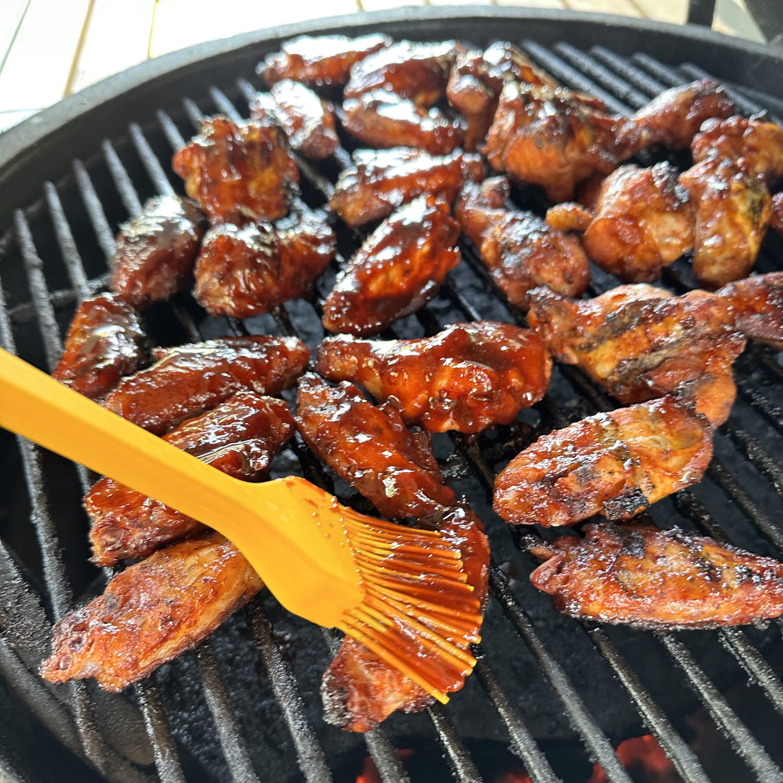 Final brush of gochujang sauce on wings.