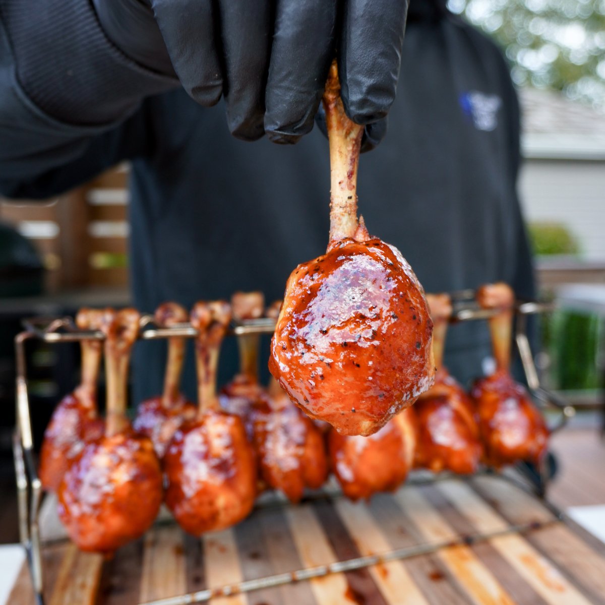 chicken lollipop being held. 