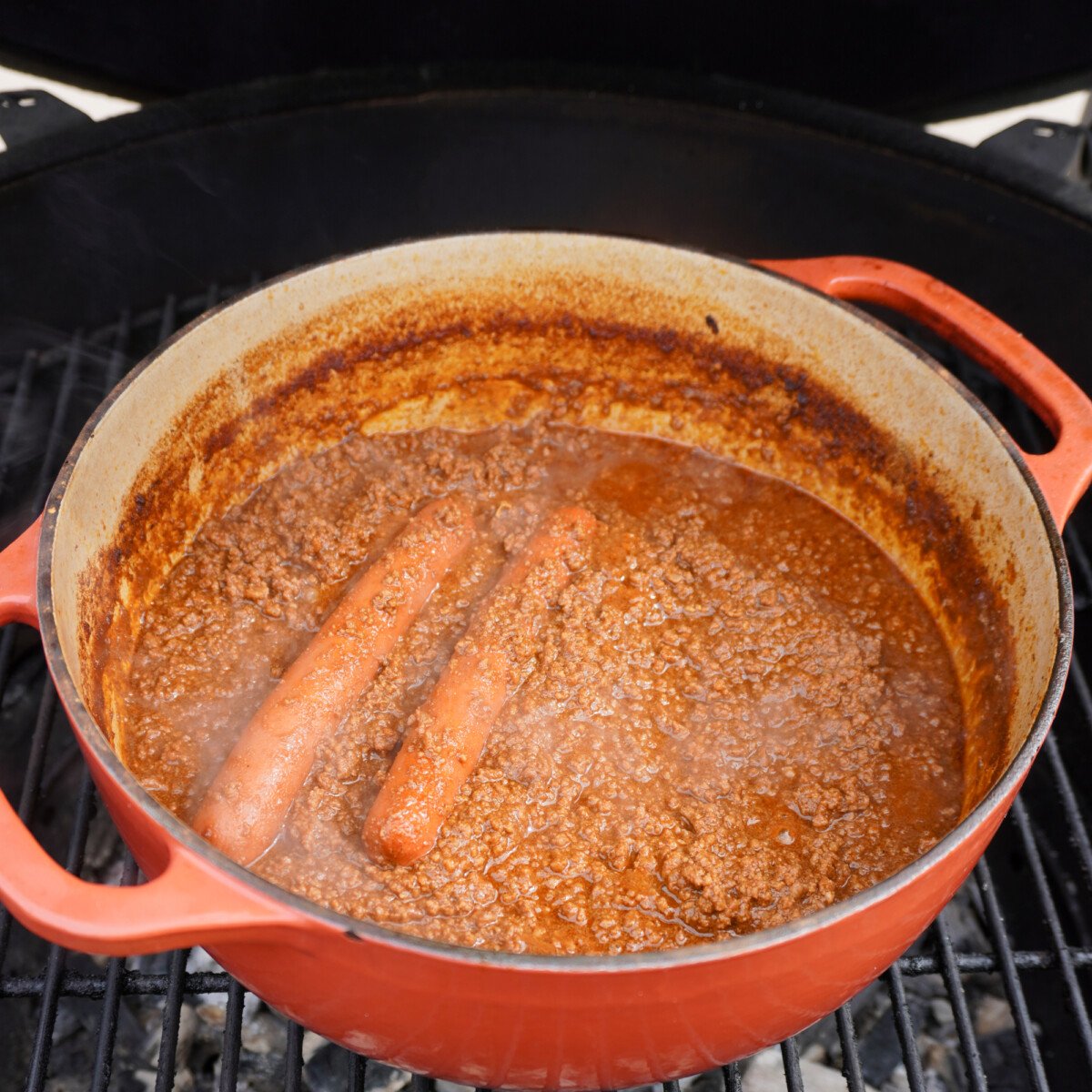 smoked chili hot dog in dutch oven.