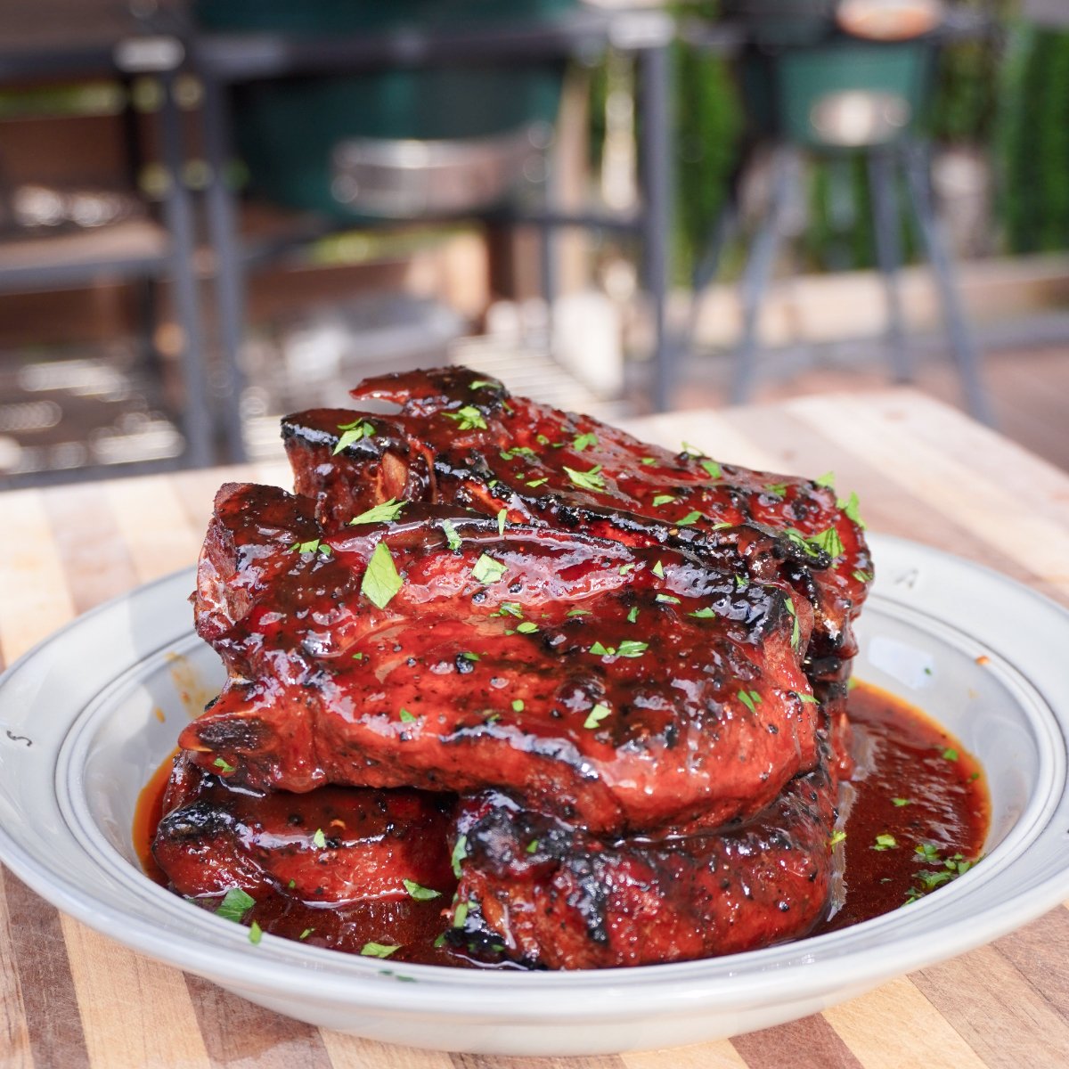 grilled country style ribs on a plate. 
