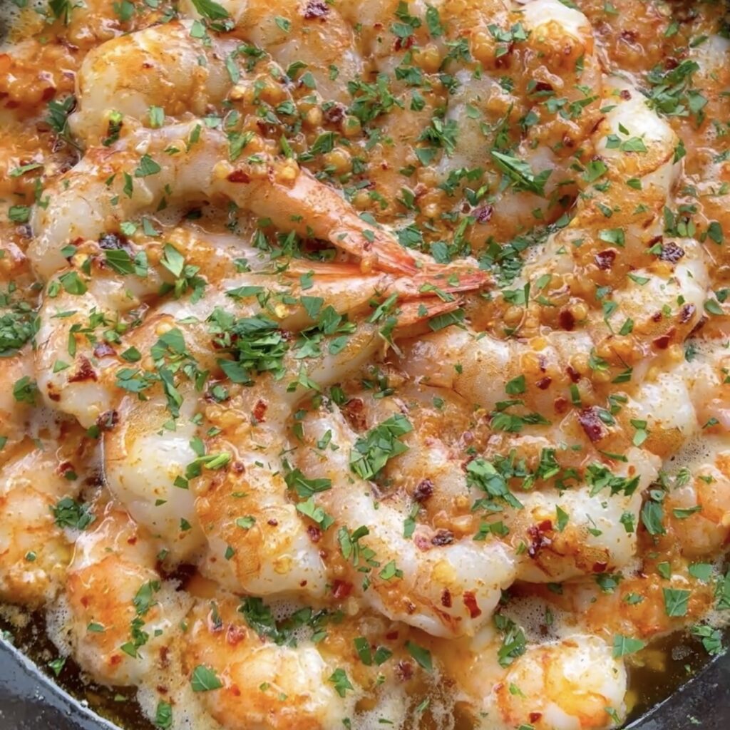 smoked shrimp covered in garlic and fresh parsley. 