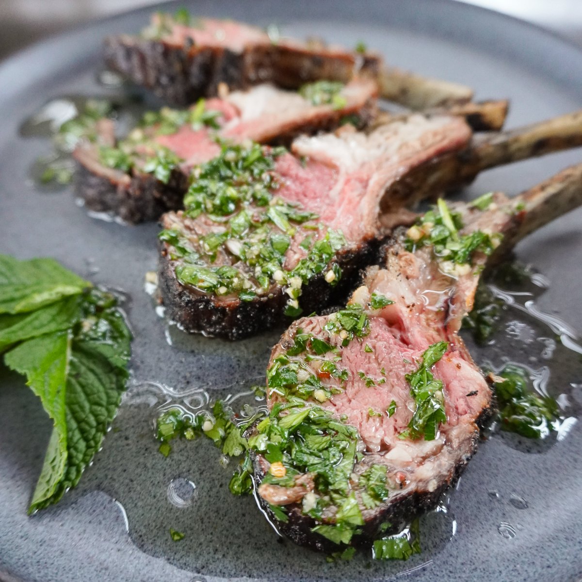 grilled rack of lamb in mint
chimichurri sauce.