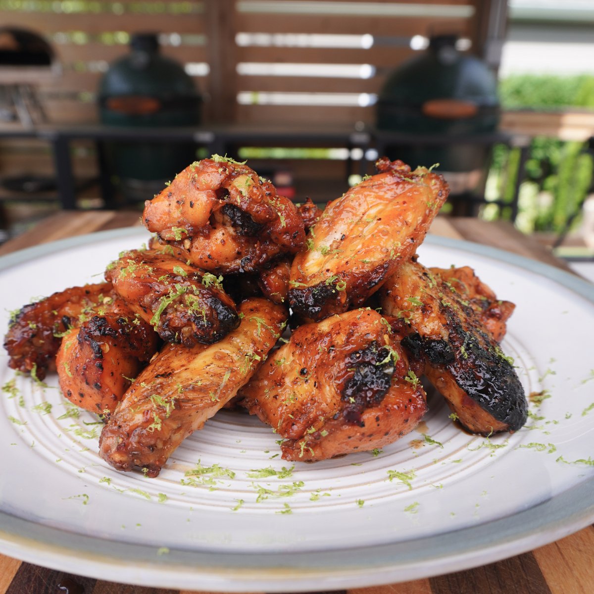 Honey Lime Chicken Wings tower plated on a white plate.