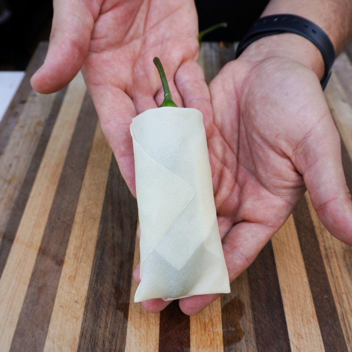 wrapped jalapeno popper lumpia in a spring roll wrapper.