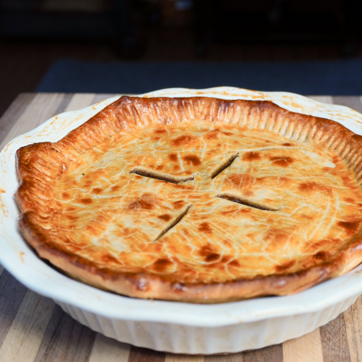 perfectly smoked meat pie in a pie dish.