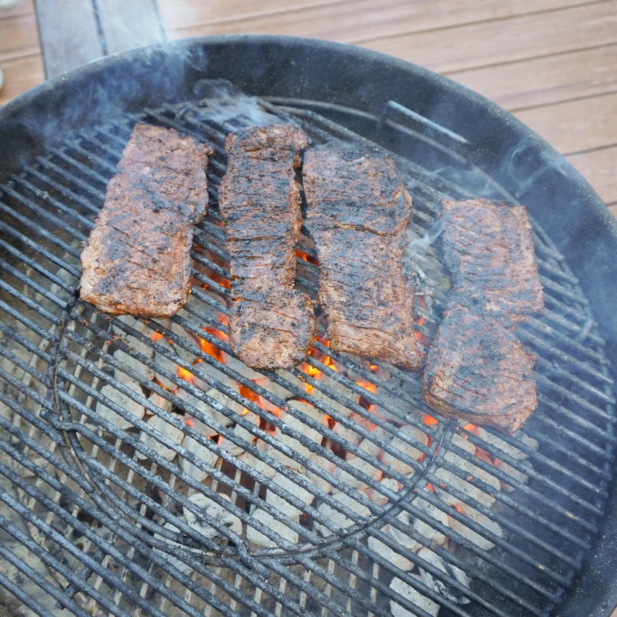 Grilled skirt steak over hot charcoal.