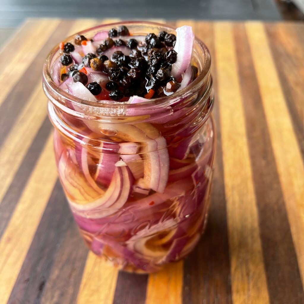 pickled onion in a mason jar.