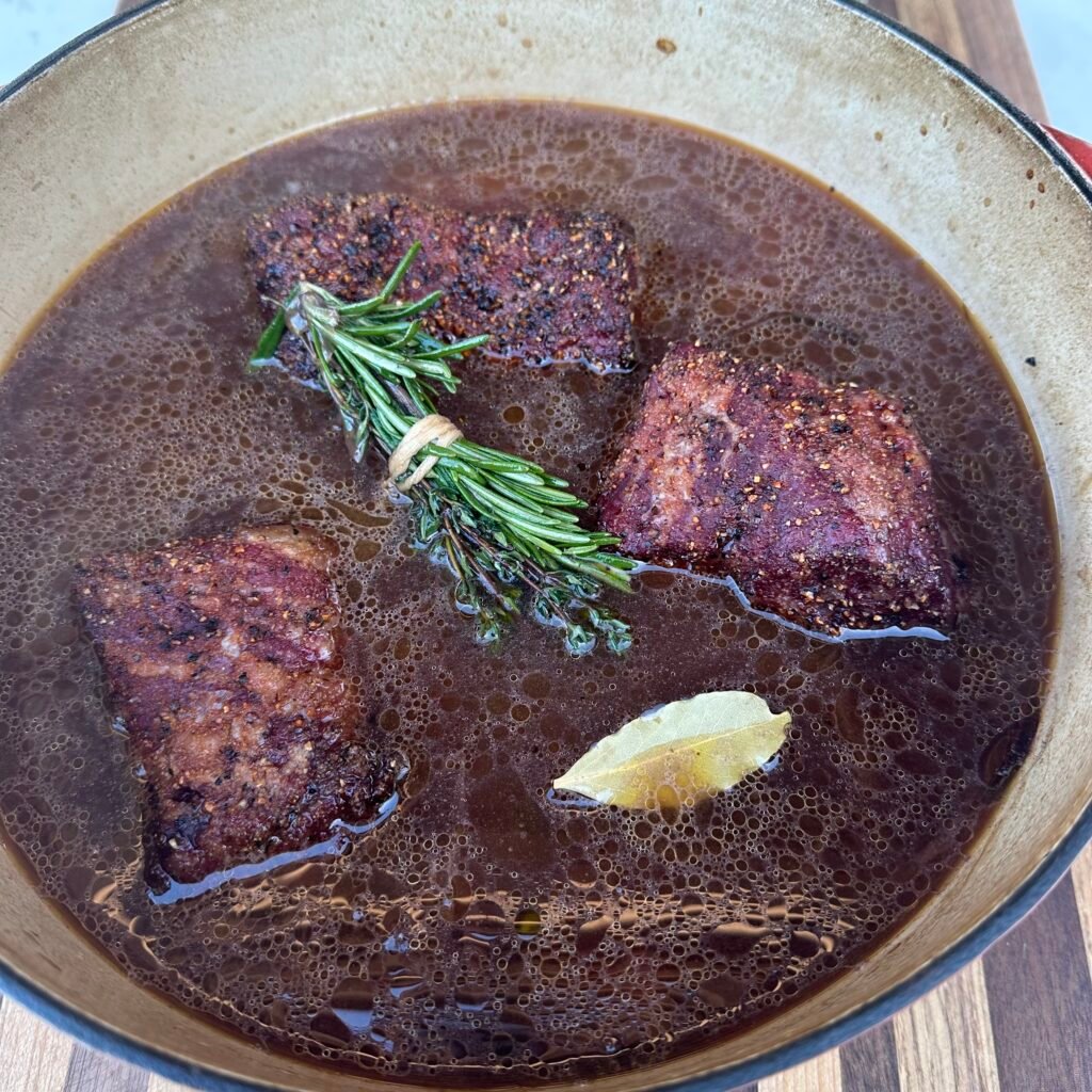 braised short ribs in a dutch oven.
