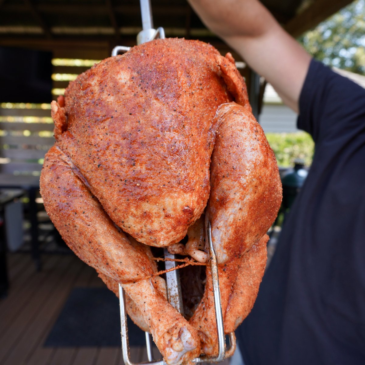 seasoned rotisserie turkey skewered on a spit.