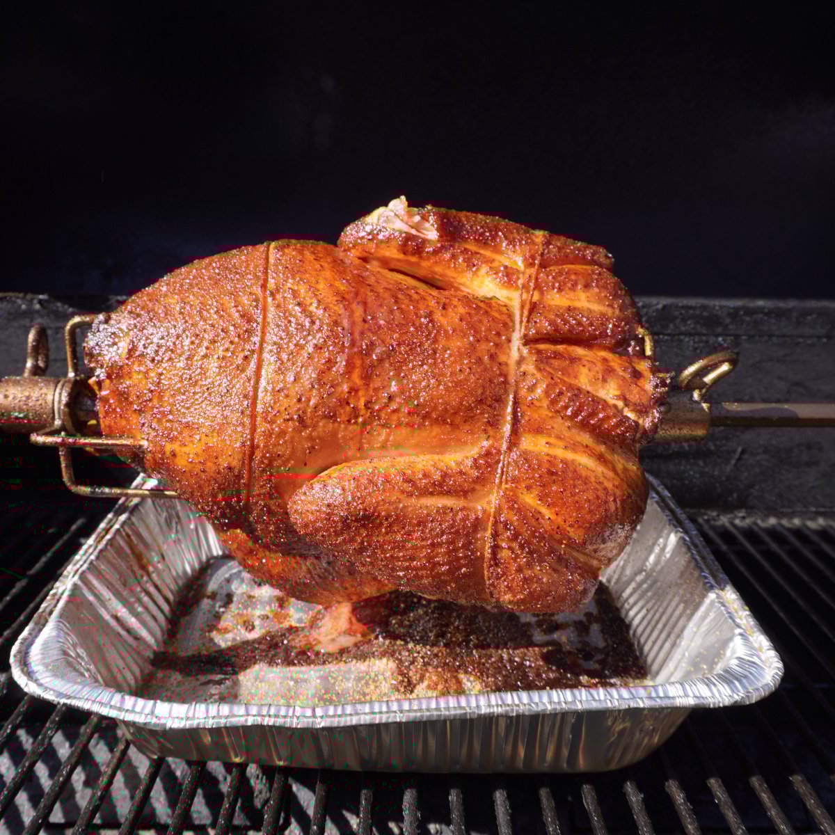 rotisserie turkey on the grill.