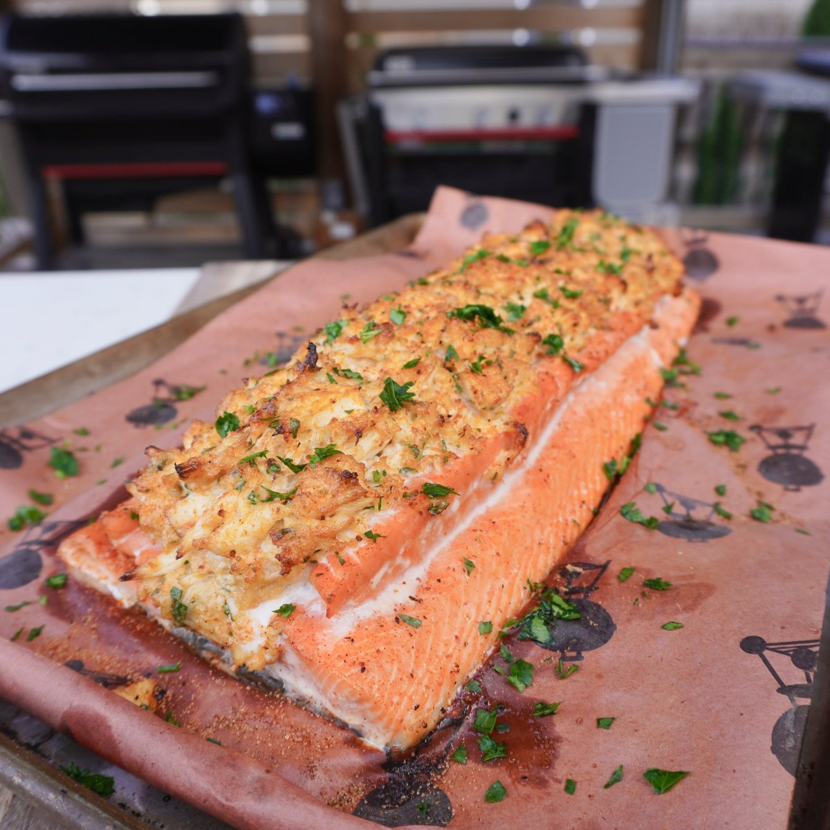 smoked crab stuffed salmon on butcher paper and cutting board.