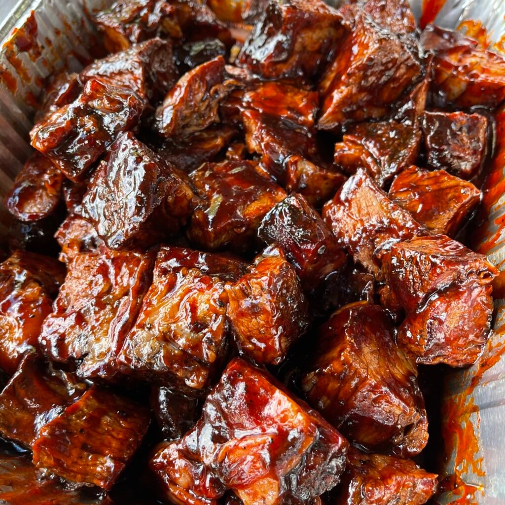 chuck roast burnt ends in a foil pan. 