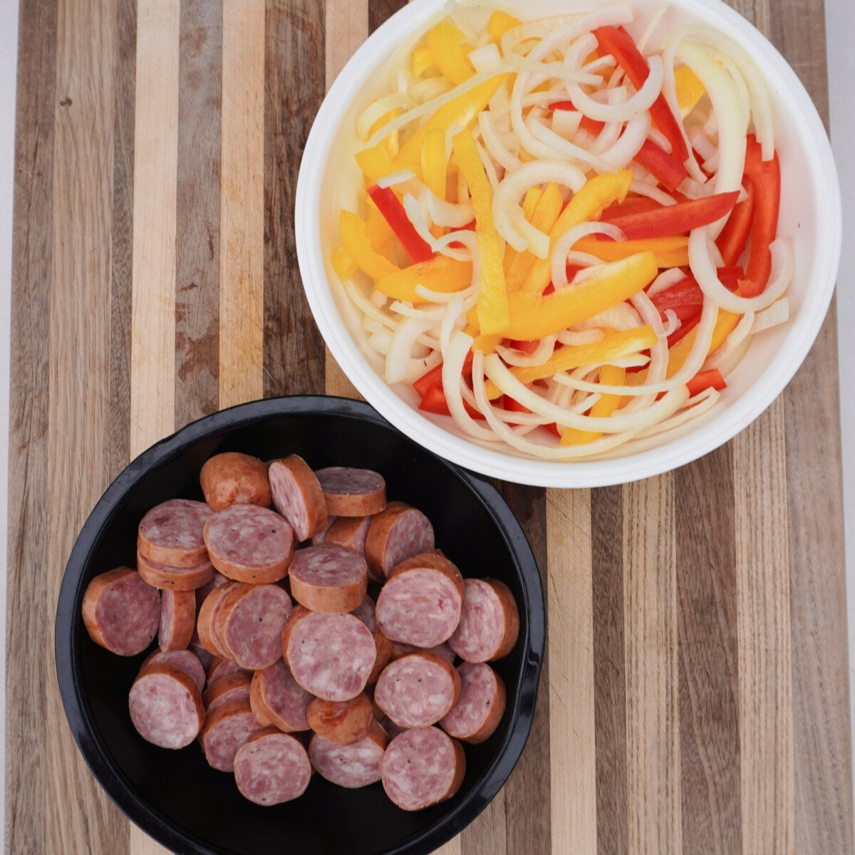 Sliced veggies and sausage.