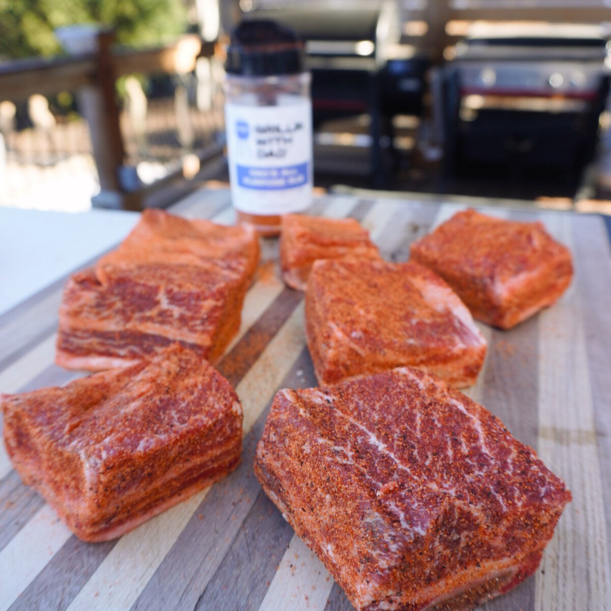 seasoned short ribs on a cutting board.