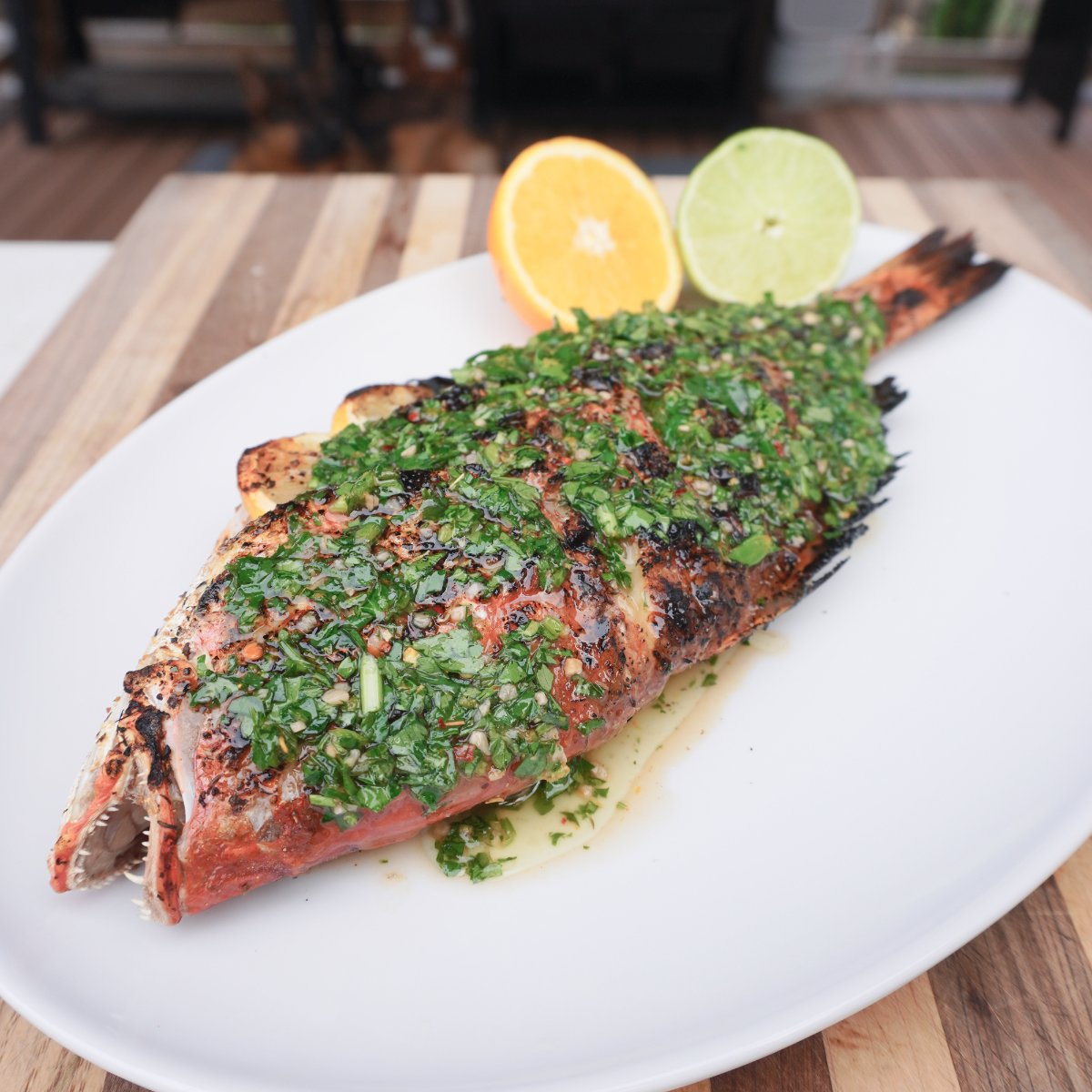 plated grilled red snapper.