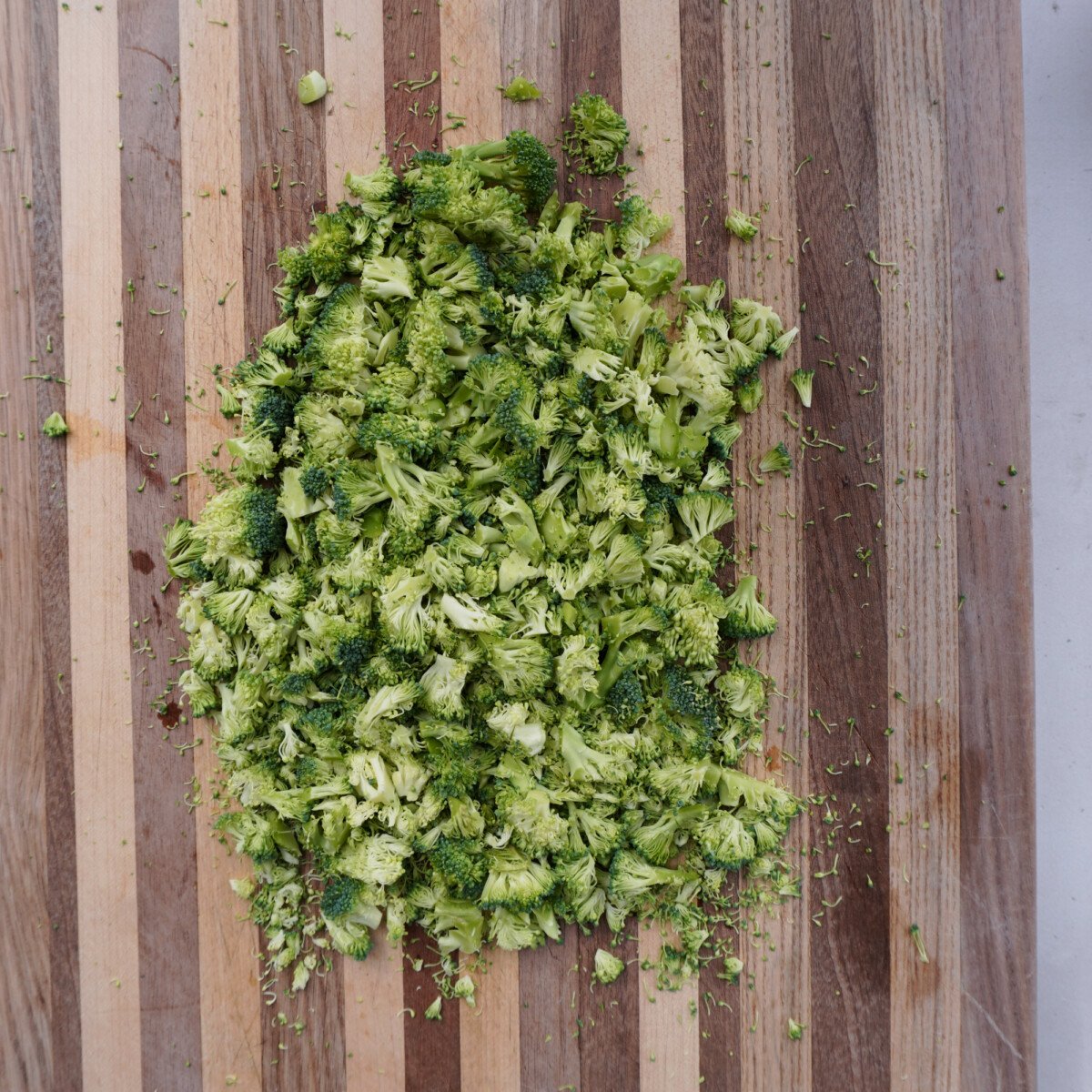 chopped raw broccoli on cutting board