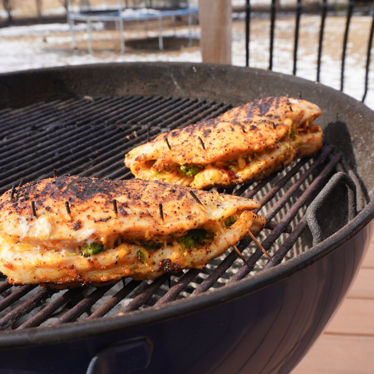 cheddar and broccoli stuffed chicken on the grill.