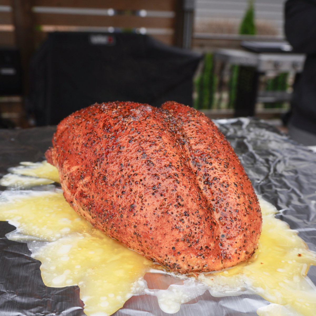 turkey. breast with butter on foil sheet. 