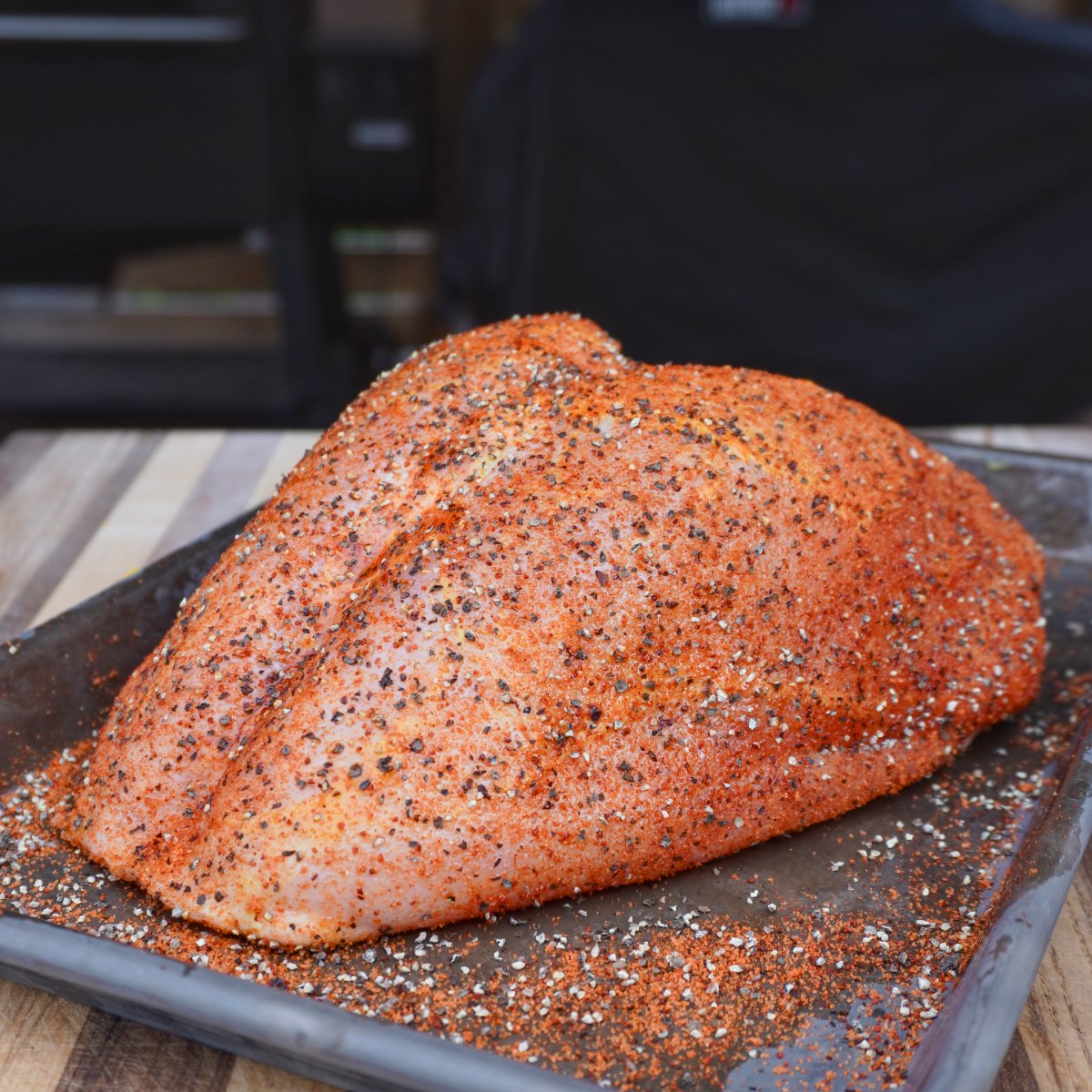 seasoned turkey breast on a tray. 